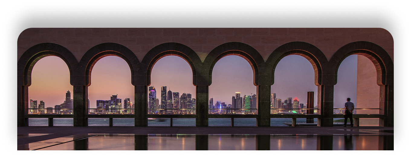 Architectural view of Qatar skyline through arched columns